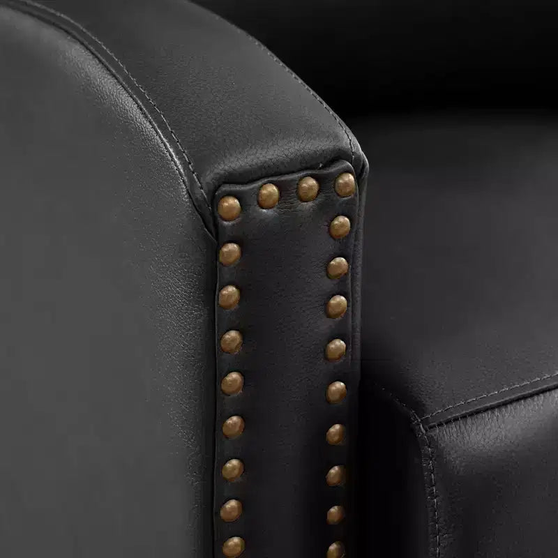 Poltrona reclinabile a spinta con rivestimento in similpelle e decorazione a rivetti