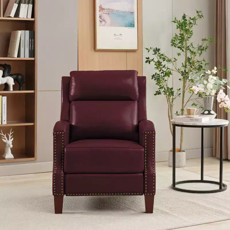 Poltrona reclinabile a spinta con rivestimento in similpelle e decorazione a rivetti