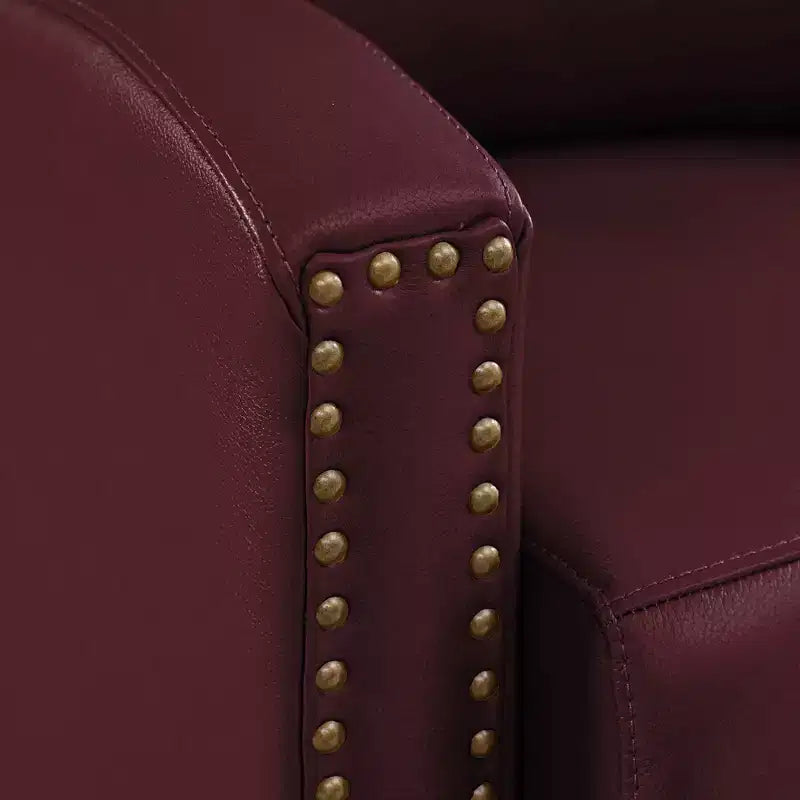 Poltrona reclinabile a spinta con rivestimento in similpelle e decorazione a rivetti