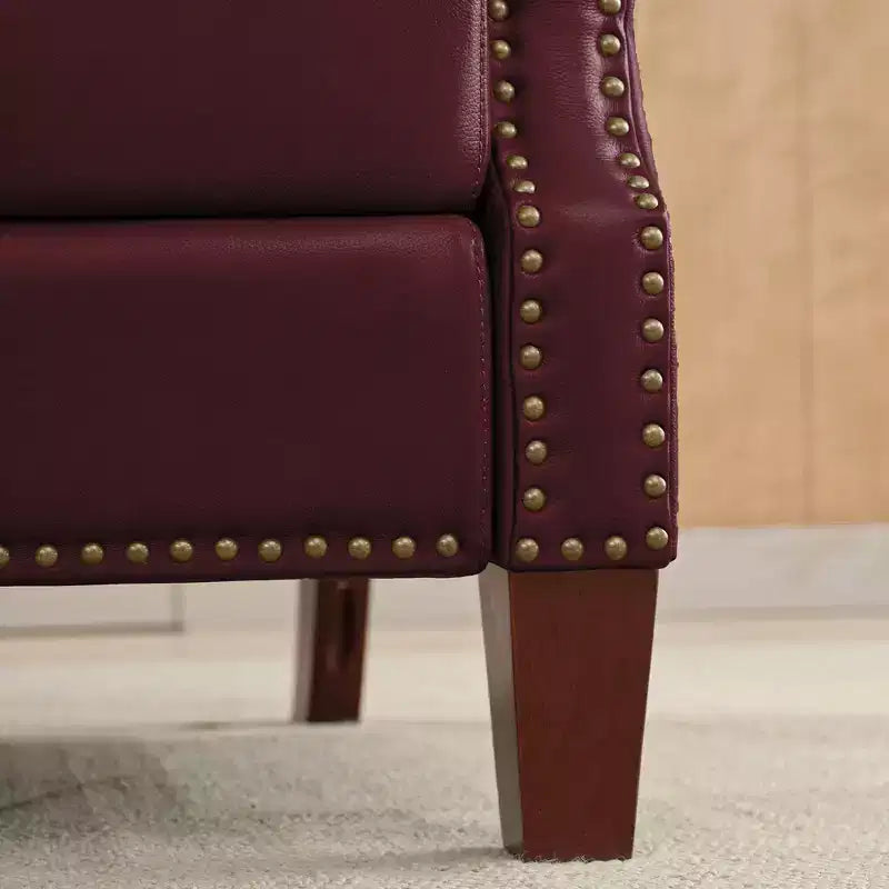 Poltrona reclinabile a spinta con rivestimento in similpelle e decorazione a rivetti