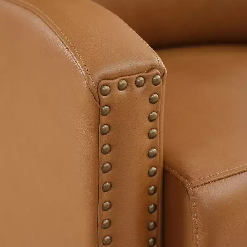 Poltrona reclinabile a spinta con rivestimento in similpelle e decorazione a rivetti