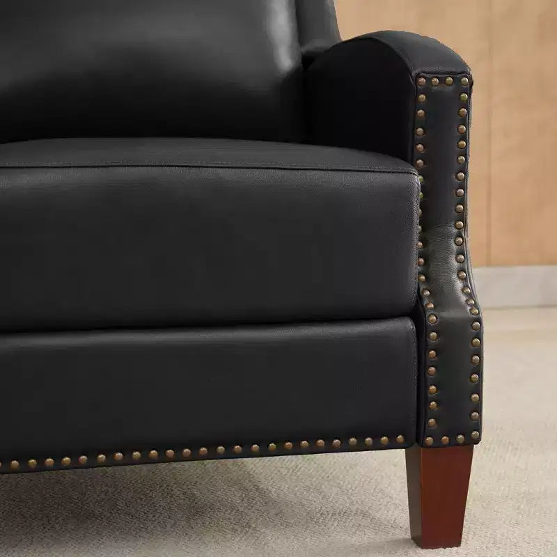 Poltrona reclinabile a spinta con rivestimento in similpelle e decorazione a rivetti